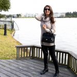 Erin from Cathedrals and Cafes blog carries the Rivington Convertible Mini Tote from Henri Bendel while wearing sunglasses