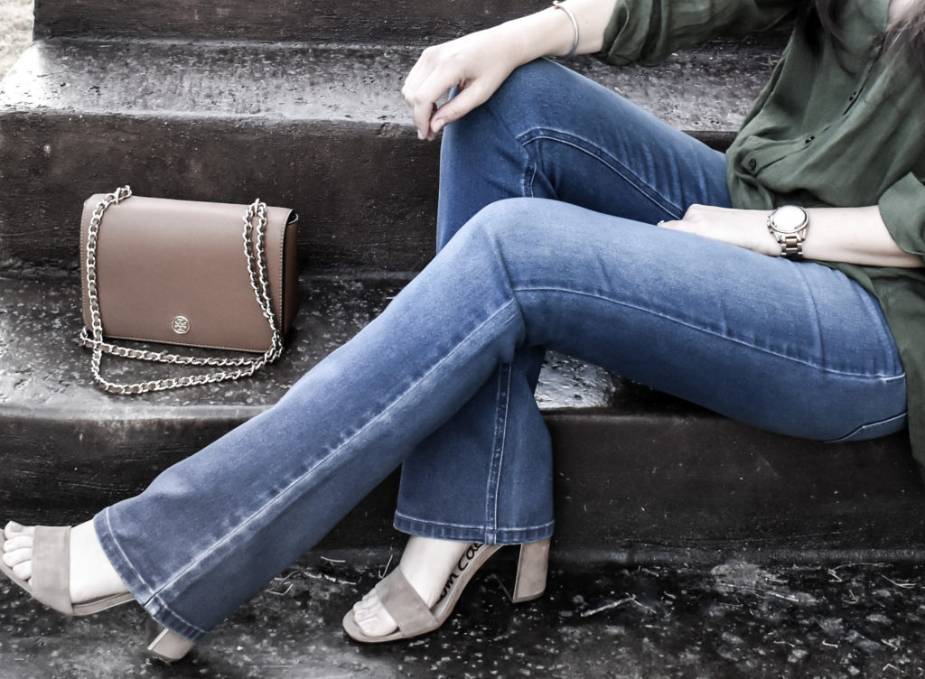 A close up of Erin from Cathedrals and Cafes modeling Diane Gilman DG2 Jeans with Sam Edleman Heels and Tory Burch bag