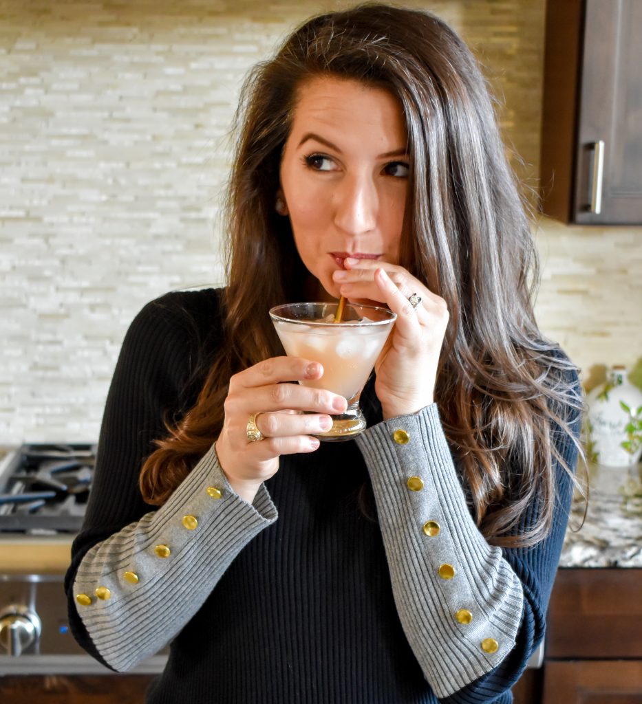 Erin from Cathedrals and Cafes sips a Galentine's Day Cocktail