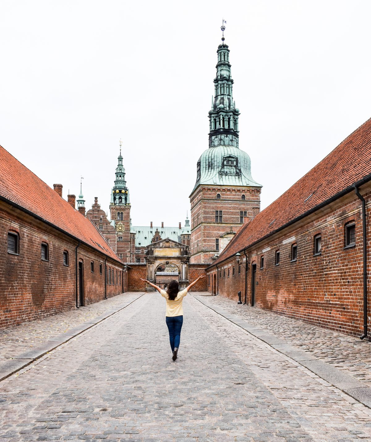 Erin walks a solitary path up to Frederiksborg Castle in Denmark