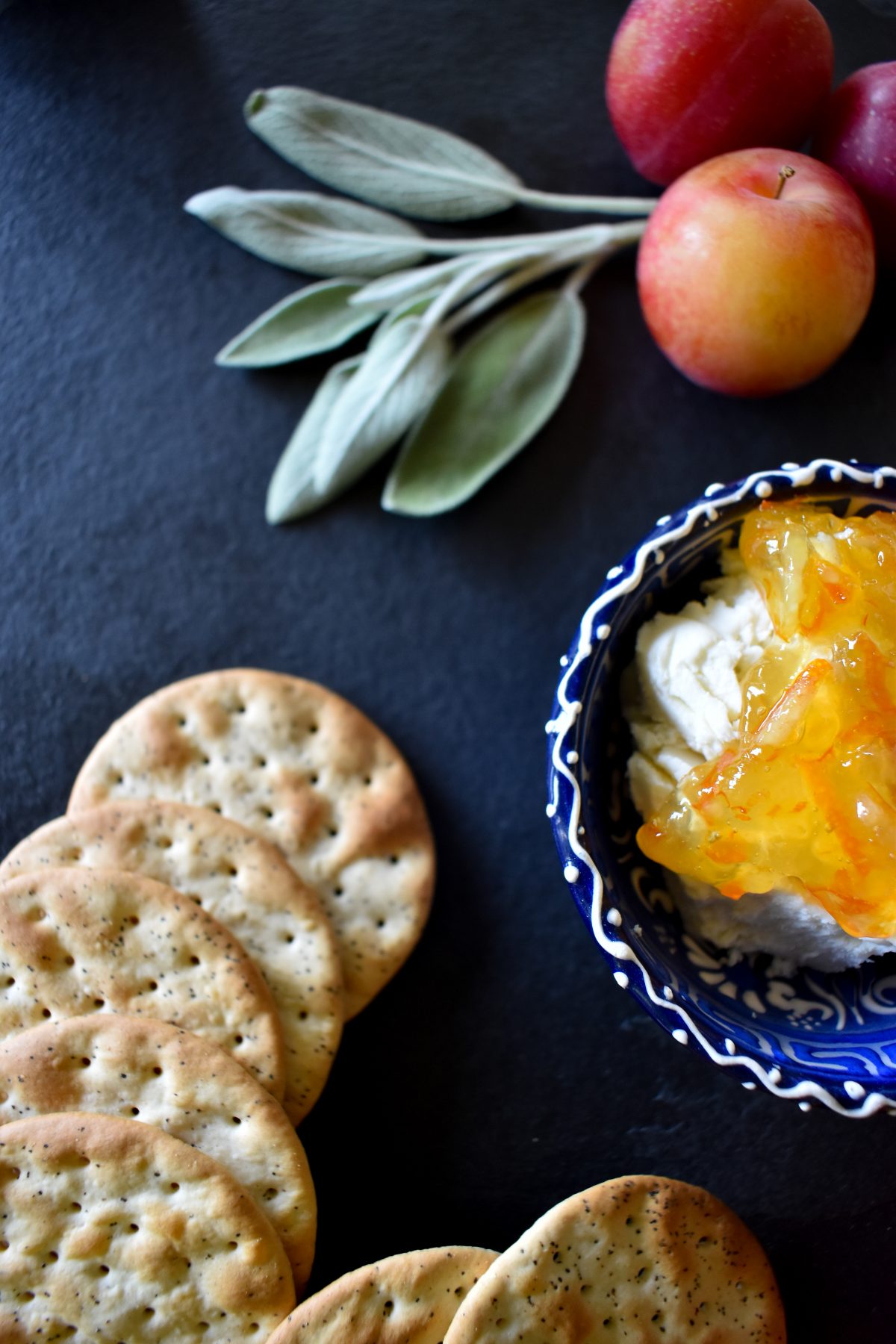 A close up of Erin's cheese board showing detail of orange marmalade and goat cheese.